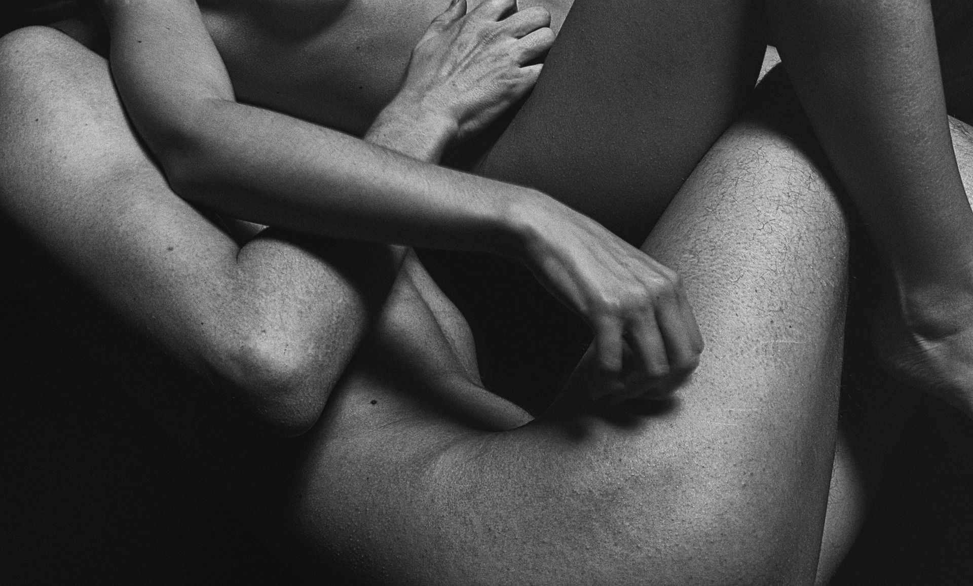 Black and white photo of a couple in a close embrace